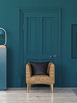 Painter rolling interior wall